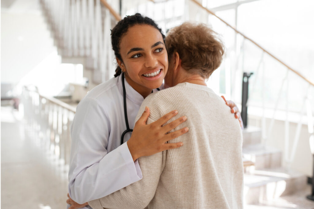 Patient and doctor hugging
