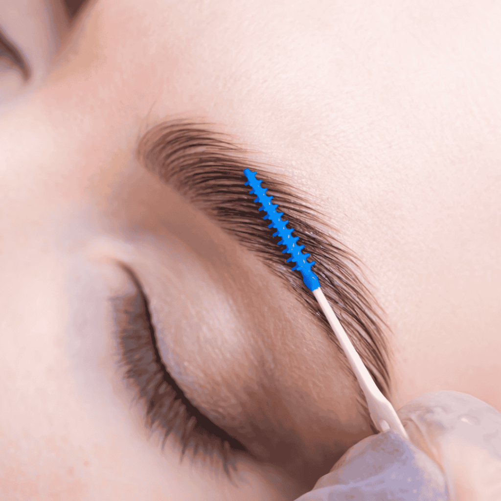 close up of woman getting brow lamination on eyebrow