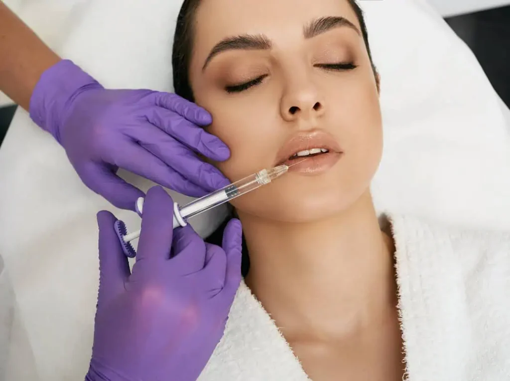 Overhead shot of nurse injecting fillers