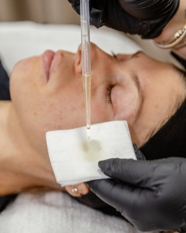 patient lays down with syringe in front of face