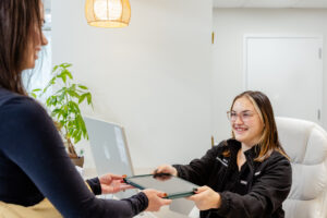 A patient smiles after receiving PRP injections in Morris County, NJ