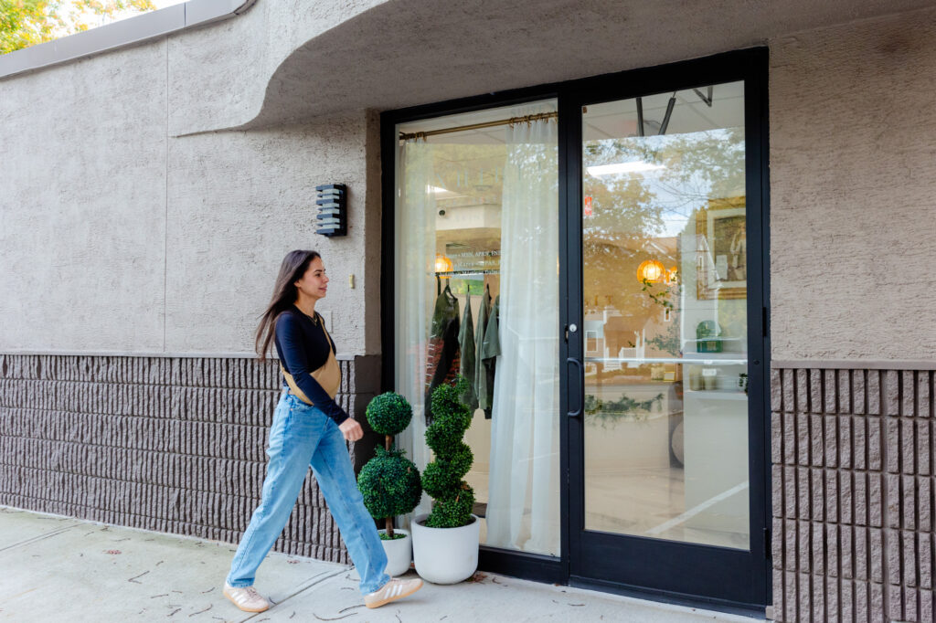 A woman approaches our clinic to learn about skincare near Madison, NJ