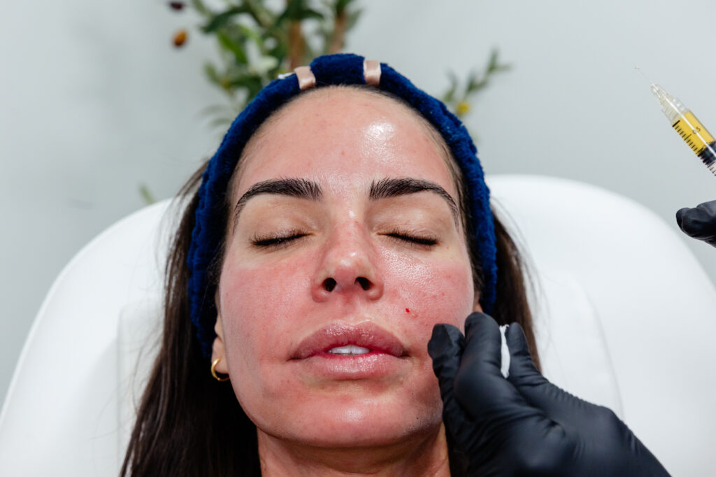 Photo of woman with eyes closed and needle beside her