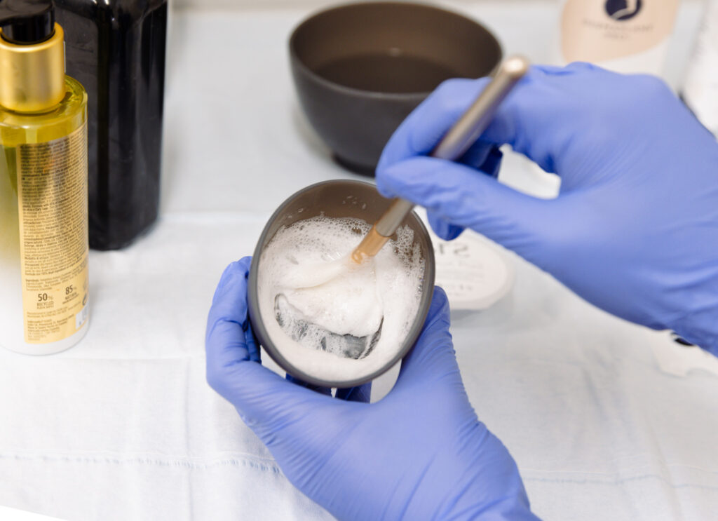 Blending Facial scrub in prep area for client