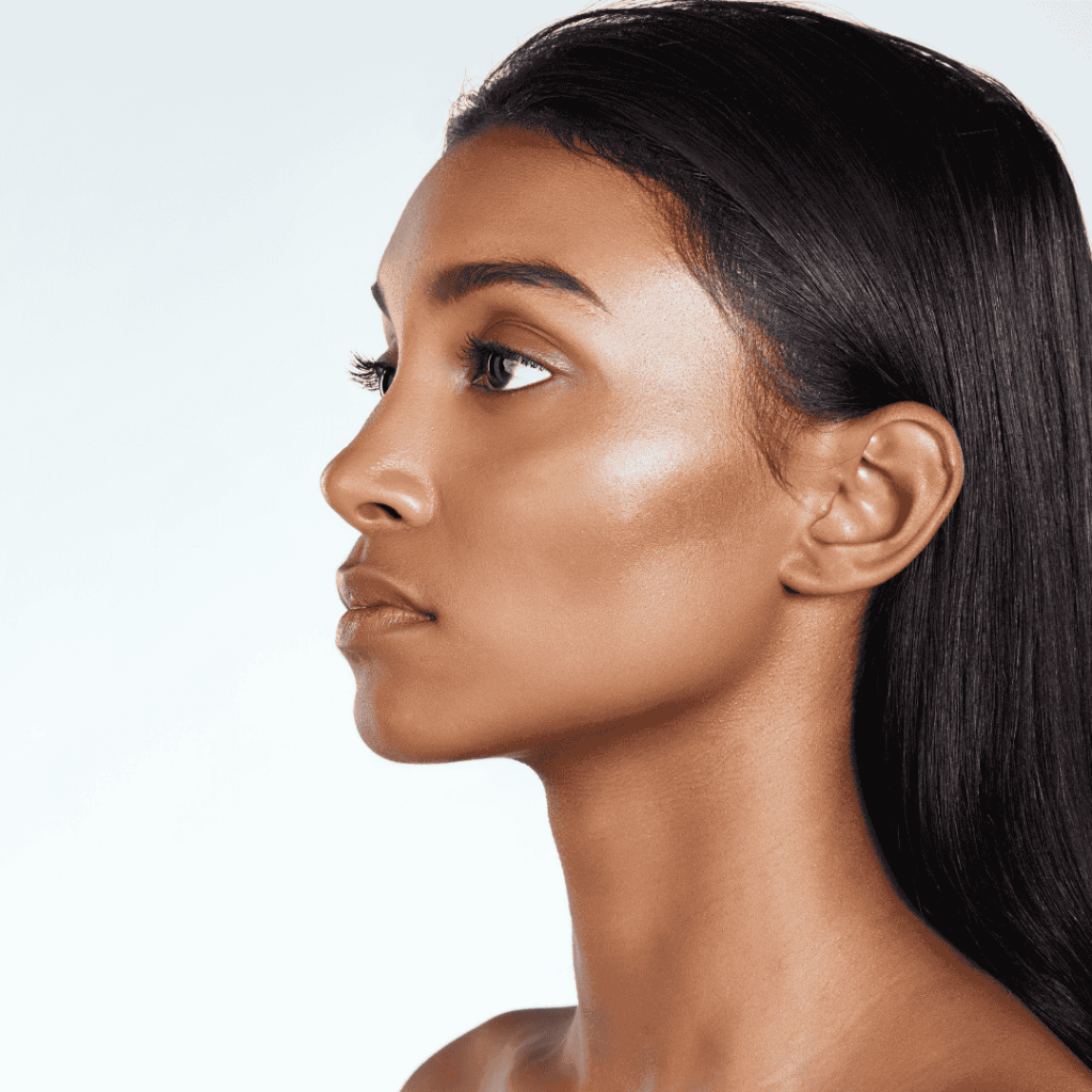 side profile of glowing woman looking into the distance