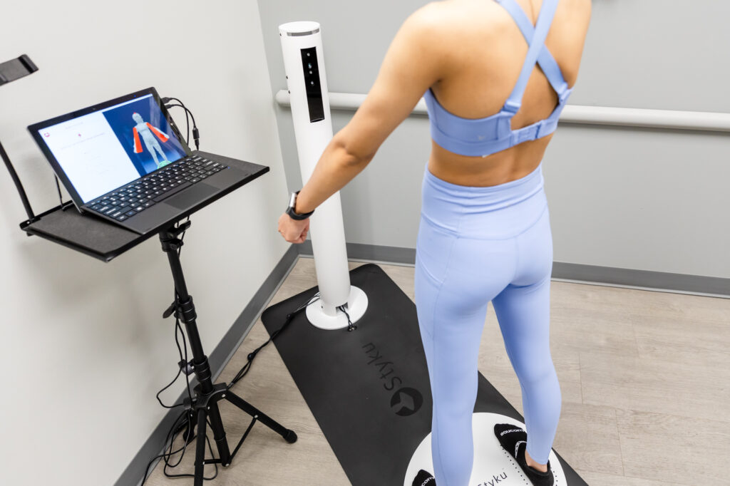 Woman standing firm on the Styku Body Scanner