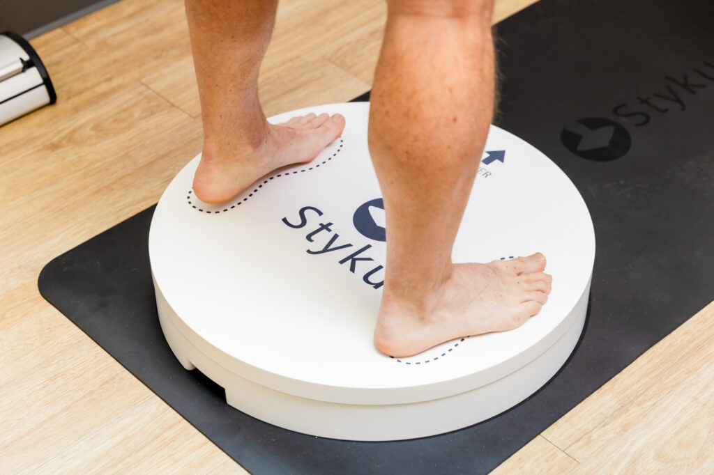 Man standing on Styku Body Composition Device