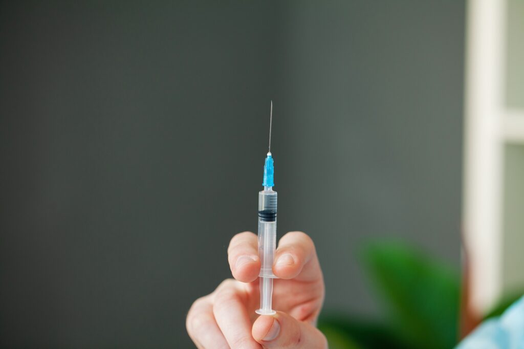 A provider prepares an injection for hormone replacement therapy near Mountain Lakes, NJ